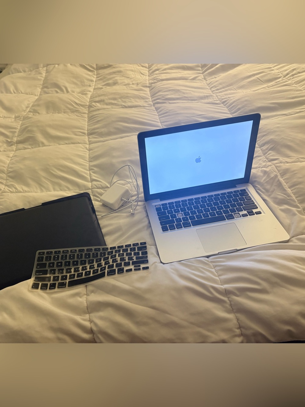 Apple Silver MacBook Pro with Charger and Keyboard Cover